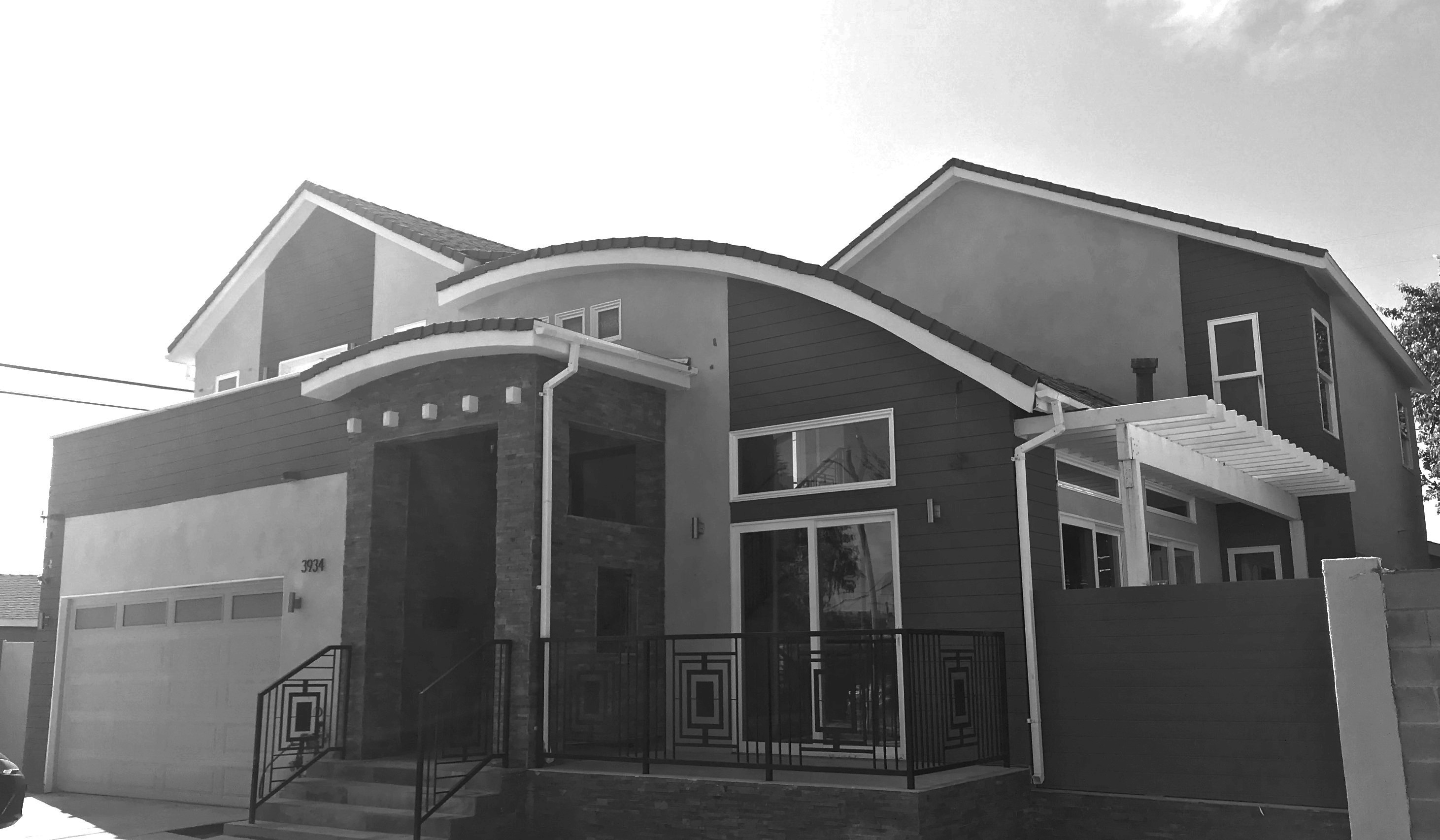 Black-and-white photograph of a completed modern single-family home